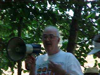 Image of Dan Hyde
using megaphone during Memorial Service, Sunday, August 6, 2000