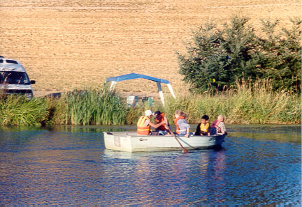 Image of kids in boat at Hahn Farm
