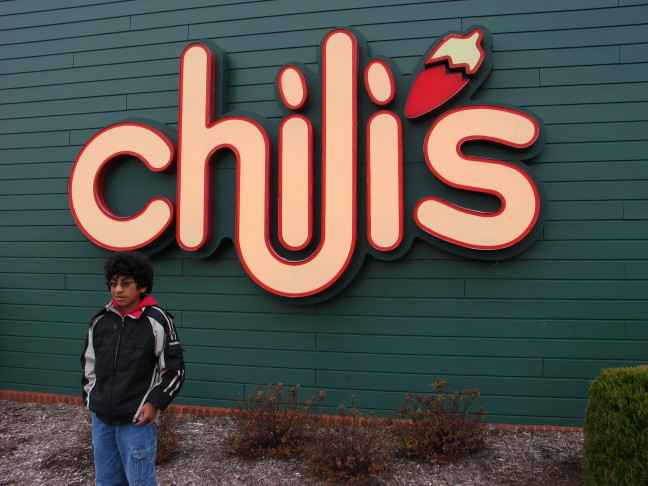 Image of Scott in front of one of his
passions - Chili's Restaurant
