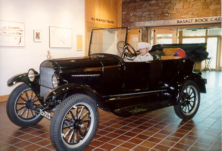 Image of Scoot in old car