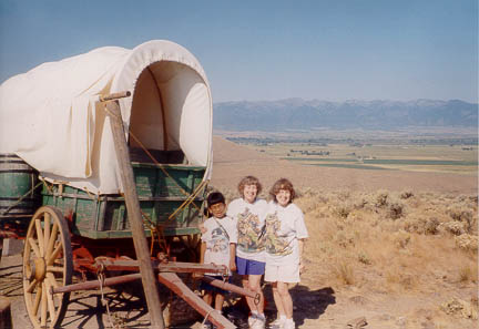 Image of Scott, Jan and Mary
Jane near restored 1880s Covered Wagon.